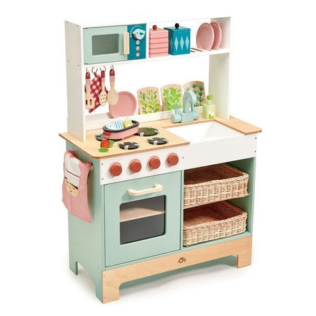 Duża drewniana kuchnia dla dzieci Tender Leaf Toys w pastelowych kolorach z pełnym wyposażeniem do gotowania.