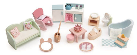 Pastelowe, drewniane łóżeczko dla lalek Tender Leaf Toys, idealne do stworzenia przytulnego wnętrza w domku dla lalek.
