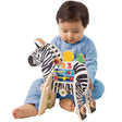 Drewniana kostka edukacyjna Zebra-Manhattan Toy. Sensoryczna zabawka z ruchomymi elementami wspiera rozwój malucha.