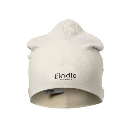 Czapka Elodie Details Creamy White, bawełniana, certyfikat Oeko-Tex, idealna na wiosnę, stylowe i wygodne okrycie dla dziecka.