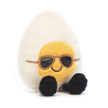 Pluszowe jajko Jellycat z różnymi fakturami, słonecznymi okularami i sportowymi bucikami - urocza maskotka dla dzieci.