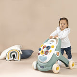 Smoby Little Chodzik Pchacz Interaktywny 3w1 z dużymi kółkami, ergonomiczną rączką i tablicą aktywności - wspiera rozwój dziecka.