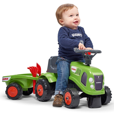 Zielony traktor zabawkowy Baby Claas z przyczepką i akcesoriami, idealny prezent dla małego traktorzysty od 1 roku.