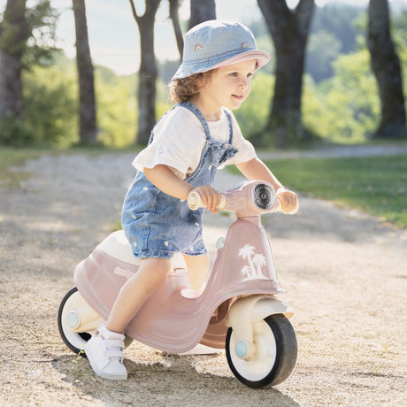 Chodzik dla dziecka Smoby, różowy jeździk pchacz, w stylu retro, wspiera naukę chodzenia i równowagi.