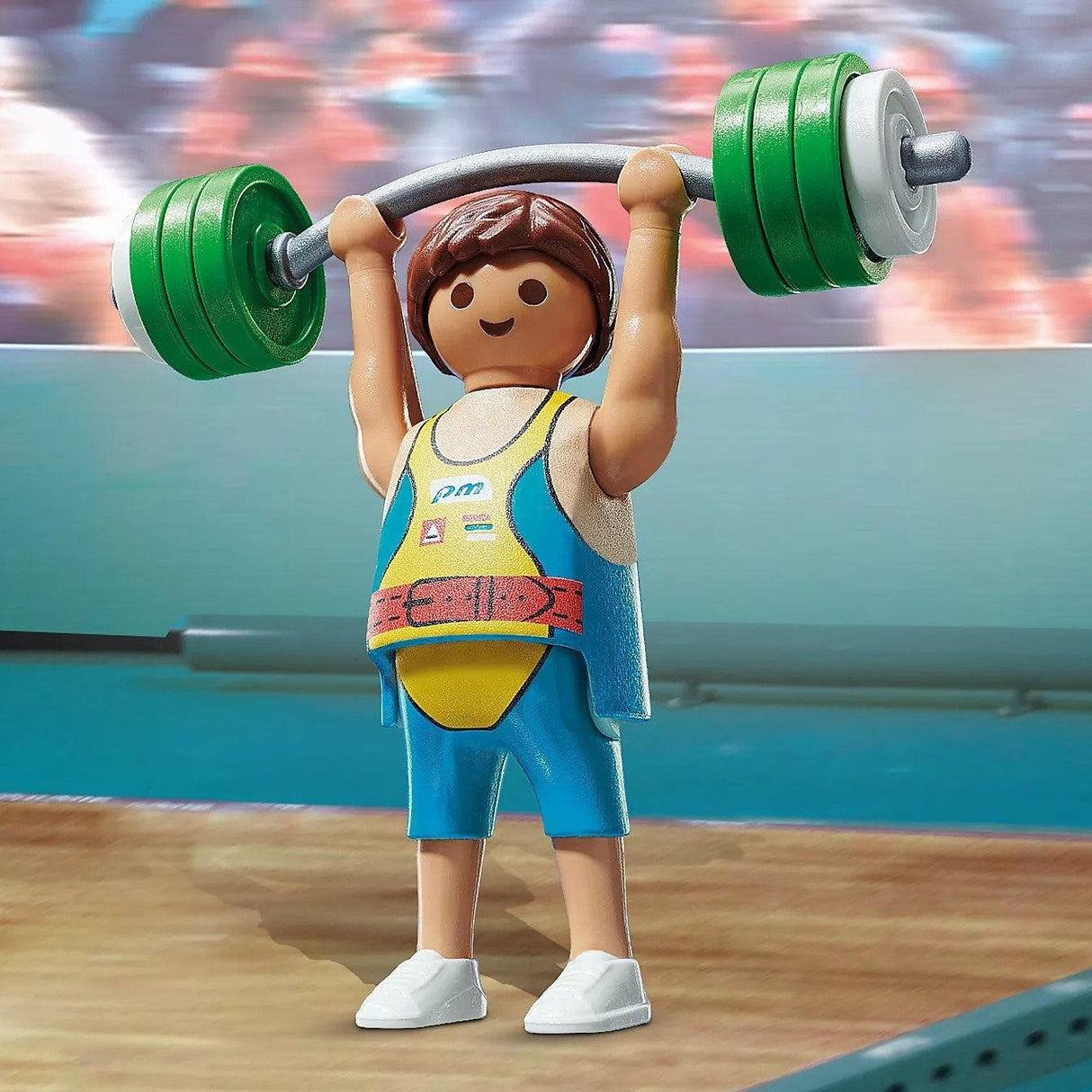 Figurka przedstawiająca sportowca sztangistę z zestawu Playmobil Playmo-Friends do podnoszenia ciężarów.