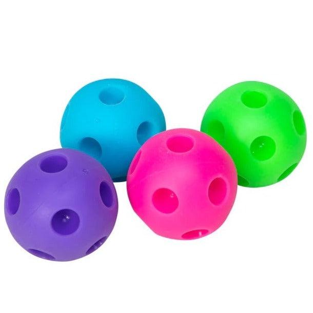 Zabawka sensoryczna Schylling Happy Snappy NeeDoh - gniotek Squishy, który pstrykając, dostarcza radości i pomaga w koncentracji.