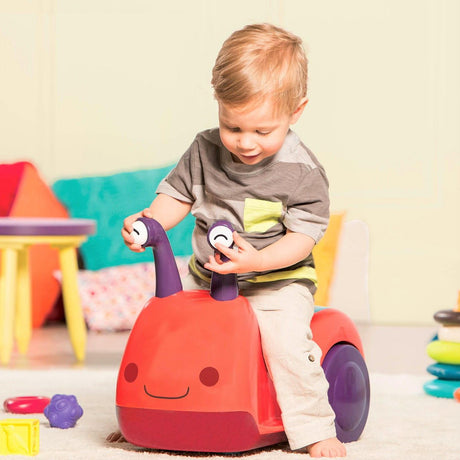 Chodzik dla dziecka B.toys Buggly Wuggly w kształcie żuczka z dźwiękami, światełkami i skrytką na skarby. Idealny pchacz dla dzieci.