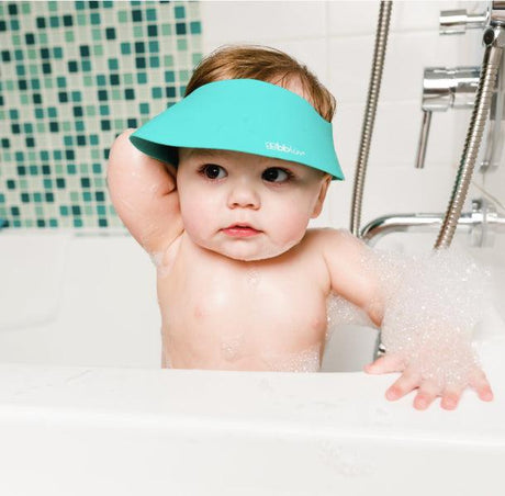 Daszek kąpielowy Bblüv chroni oczy dziecka przed wodą i szamponem, czepek kąpielowy, miękkie i elastyczne rondo kąpielowe.