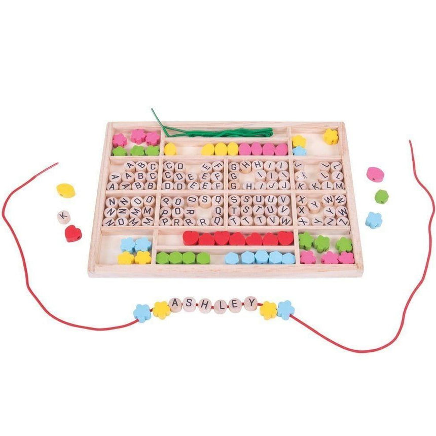 Bigjigs Toys: drewniane koraliki do nawlekania Literki - Noski Noski
