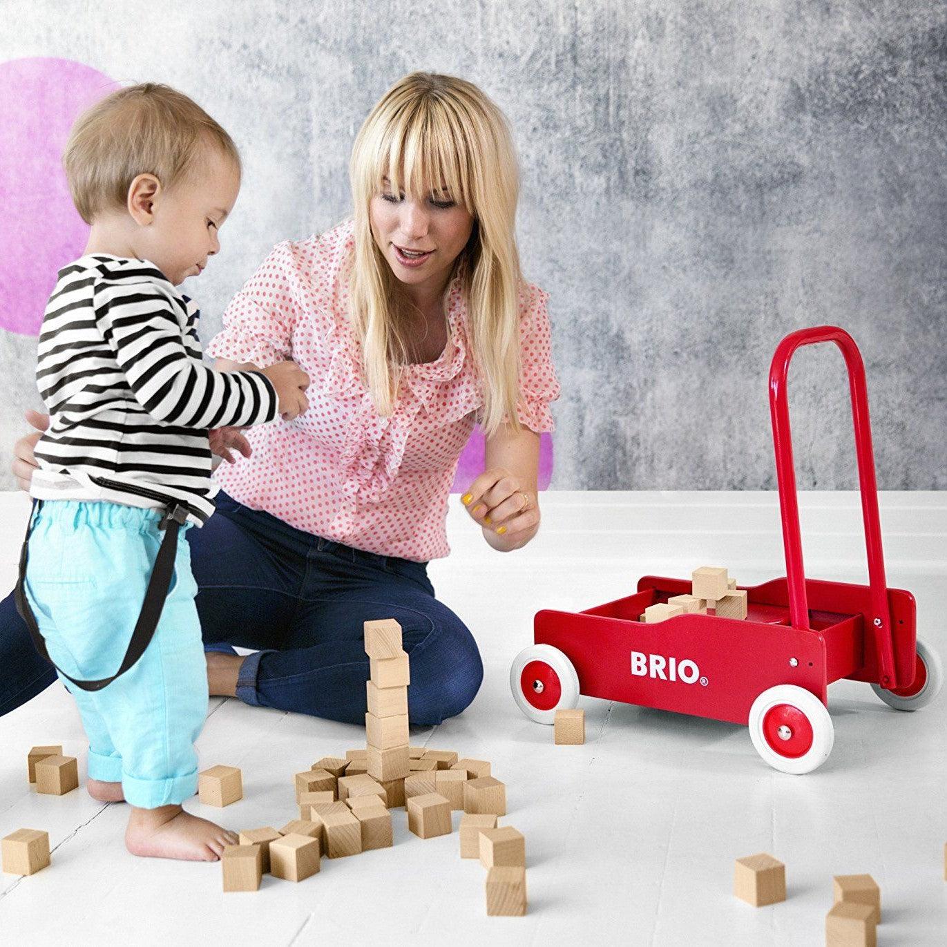 BRIO: drewniany pchacz do nauki chodzenia czerwony Toddler Wobbler - Noski Noski
