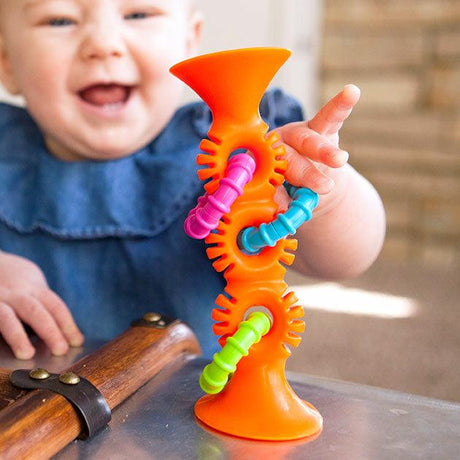 Zabawka sensoryczna Fat Brain Toys PipSquigz Loops, kolorowa grzechotka z przyssawką i gryzakiem, rozwijająca motorykę.