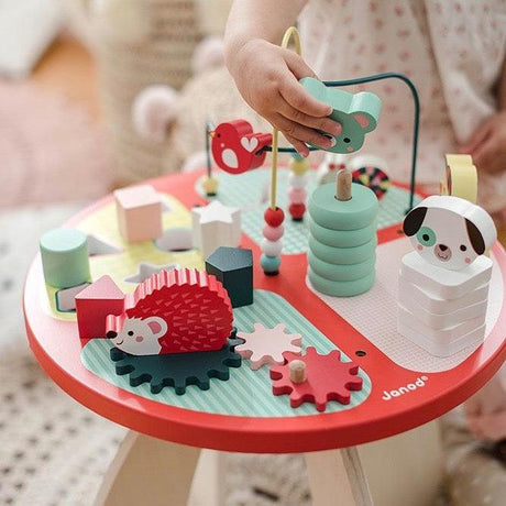 Stolik edukacyjny Janod Baby Forest - bezpieczna, drewniana i interaktywna zabawka edukacyjna dla roczniaka.