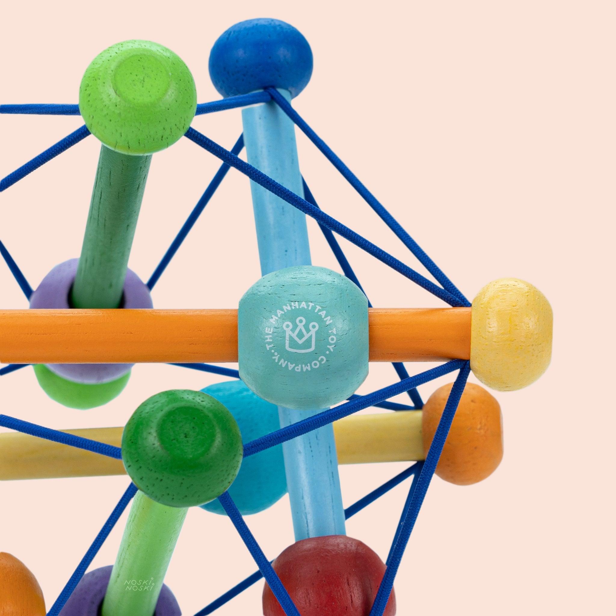 Manhattan Toy: drewniana zabawka dla niemowląt Skwish Color Burst - Noski Noski