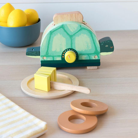 Drewniany toster zabawka Manhattan Toy Toasty Turtle dla dzieci z dźwignią i pokrętłem, idealny do zabawy w gotowanie.