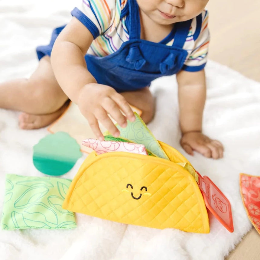 Melissa and Doug: zabawka sensoryczna dla niemowląt Soft Taco Fill & Spill - Noski Noski