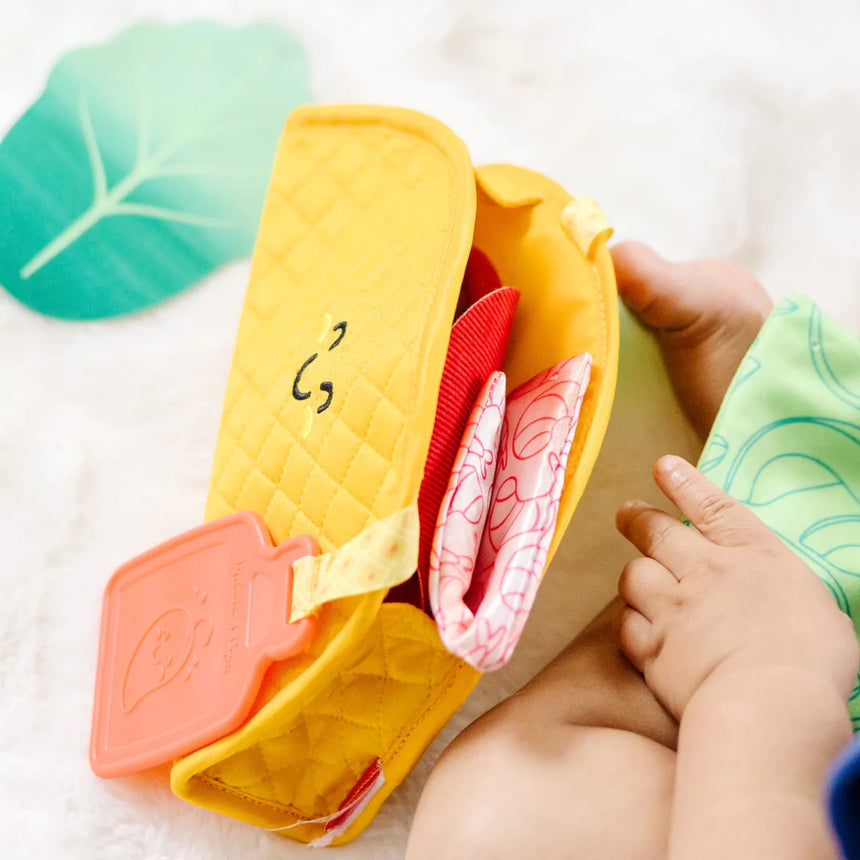 Melissa and Doug: zabawka sensoryczna dla niemowląt Soft Taco Fill & Spill - Noski Noski