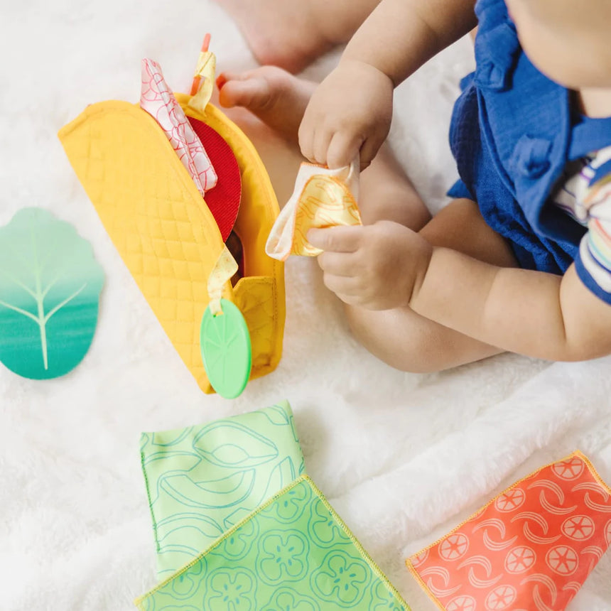 Melissa and Doug: zabawka sensoryczna dla niemowląt Soft Taco Fill & Spill - Noski Noski