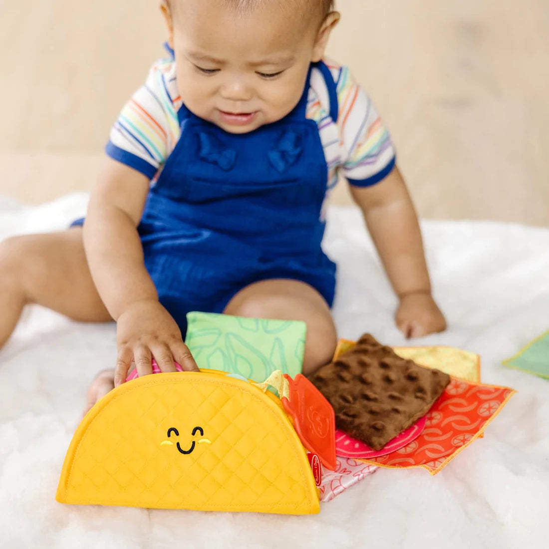 Melissa and Doug: zabawka sensoryczna dla niemowląt Soft Taco Fill & Spill - Noski Noski