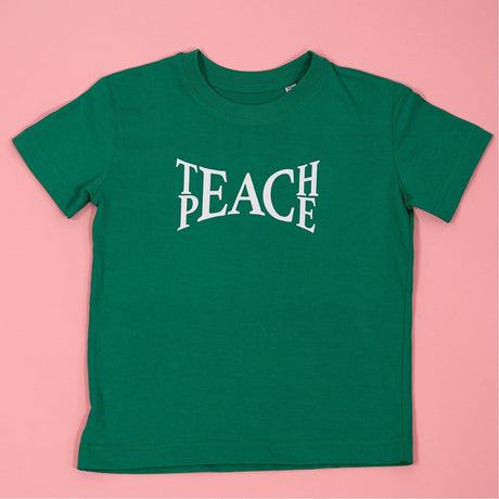 Koszulka dla dziecka Noski Teach Peace z napisem, UV, bawełna, codzienna wygoda, przesłanie pokoju i szacunku.