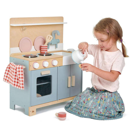 Kuchnia drewniana dla dzieci Tender Leaf Toys Mini Chef w stylu retro z piekarnikiem, płytą grzewczą i zlewozmywakiem.