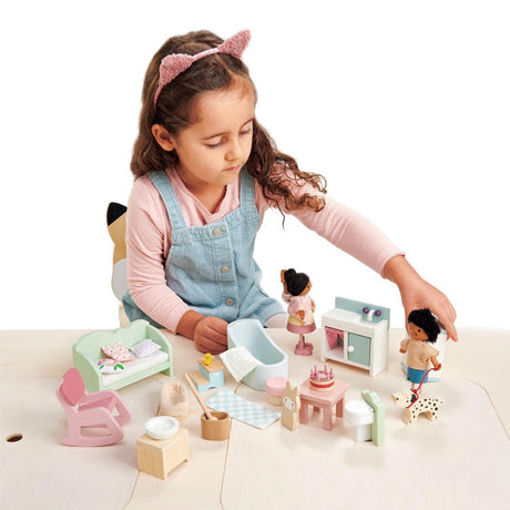 Łóżeczko dla lalek Tender Leaf Toys z akcesoriami, nowoczesny design i wysokiej jakości detale, idealne do zabawy.